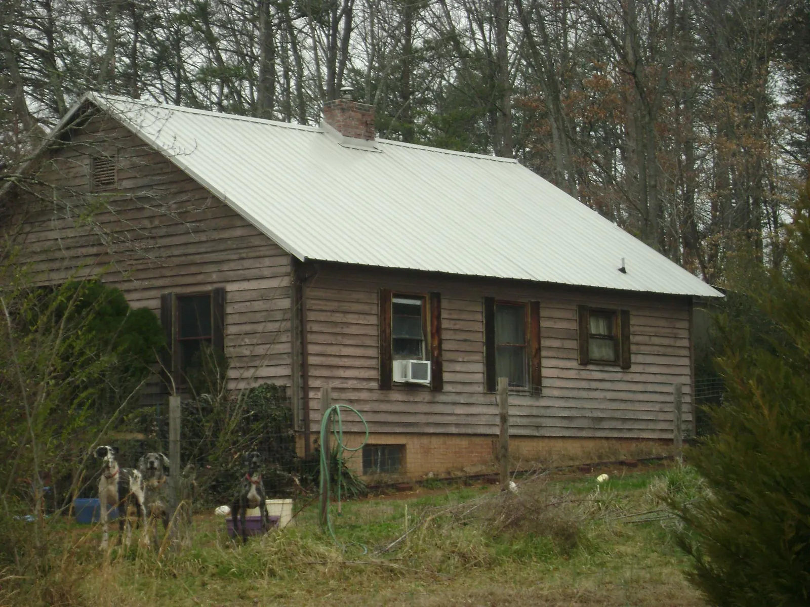 White metal roof on an old wood sided farmhouse in Andover
